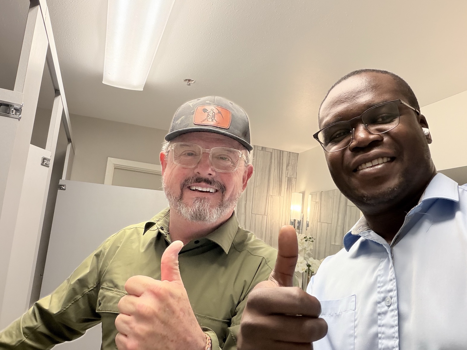 Chris from Aim Dynamics and installer Jarrett after the completed toilet upgrade