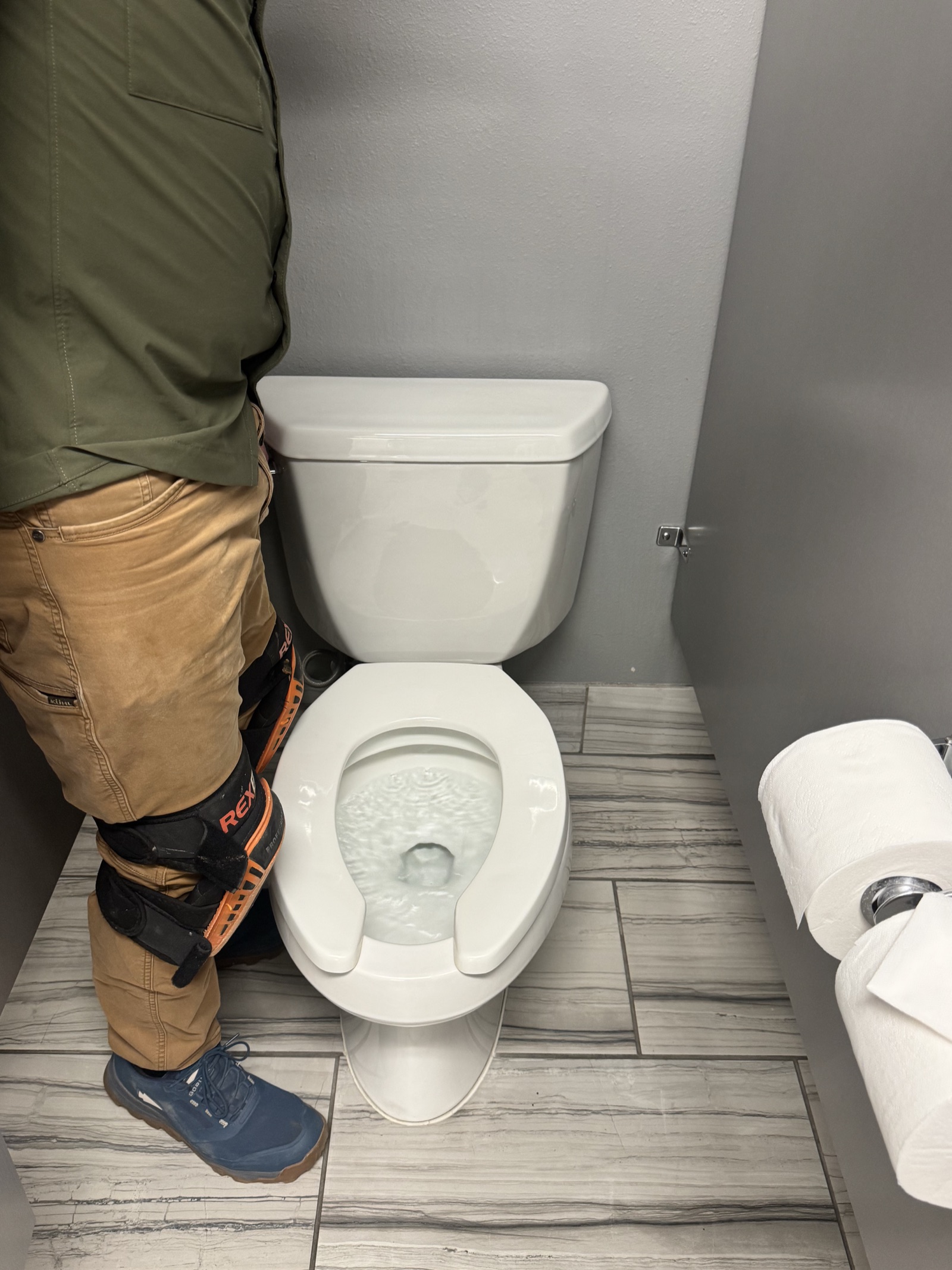 The older 3.2 gallons-per-flush toilet before removal